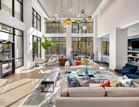 A modern living room with a large sectional sofa and a coffee table.