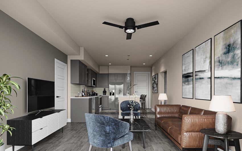 a living room and kitchen with a ceiling fan