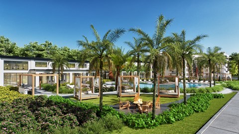 A modern residential area with a pool and palm trees.