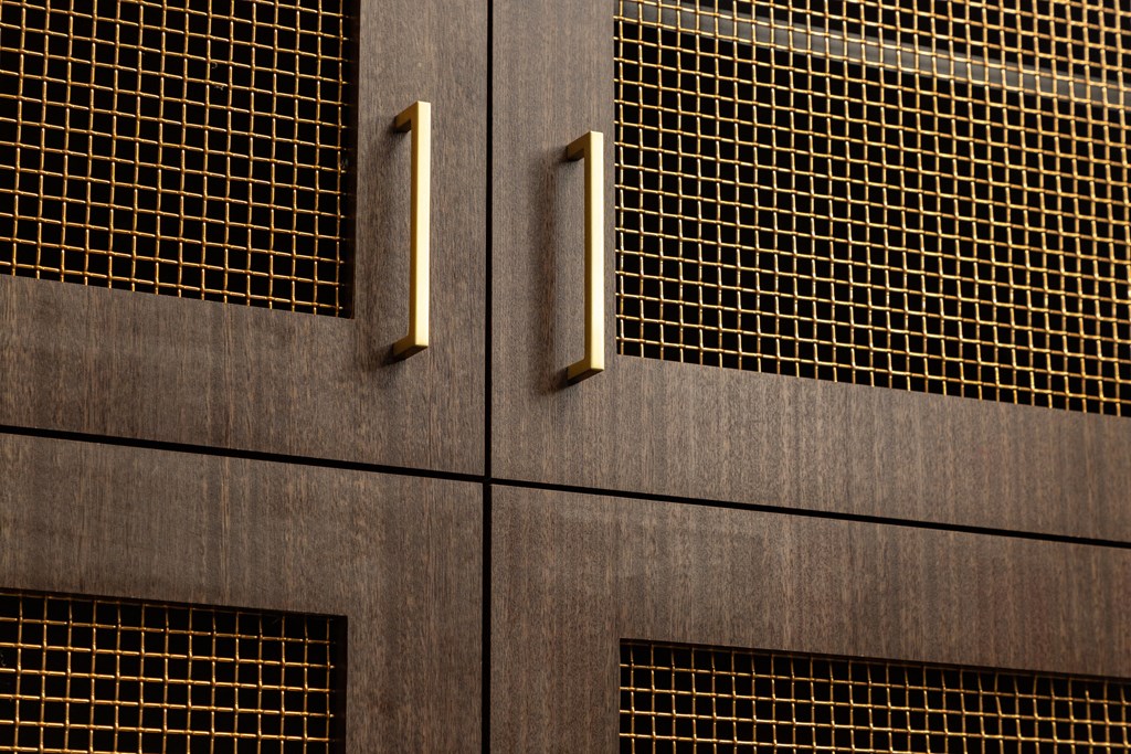 A brown door with gold handles and a grid pattern on the side.