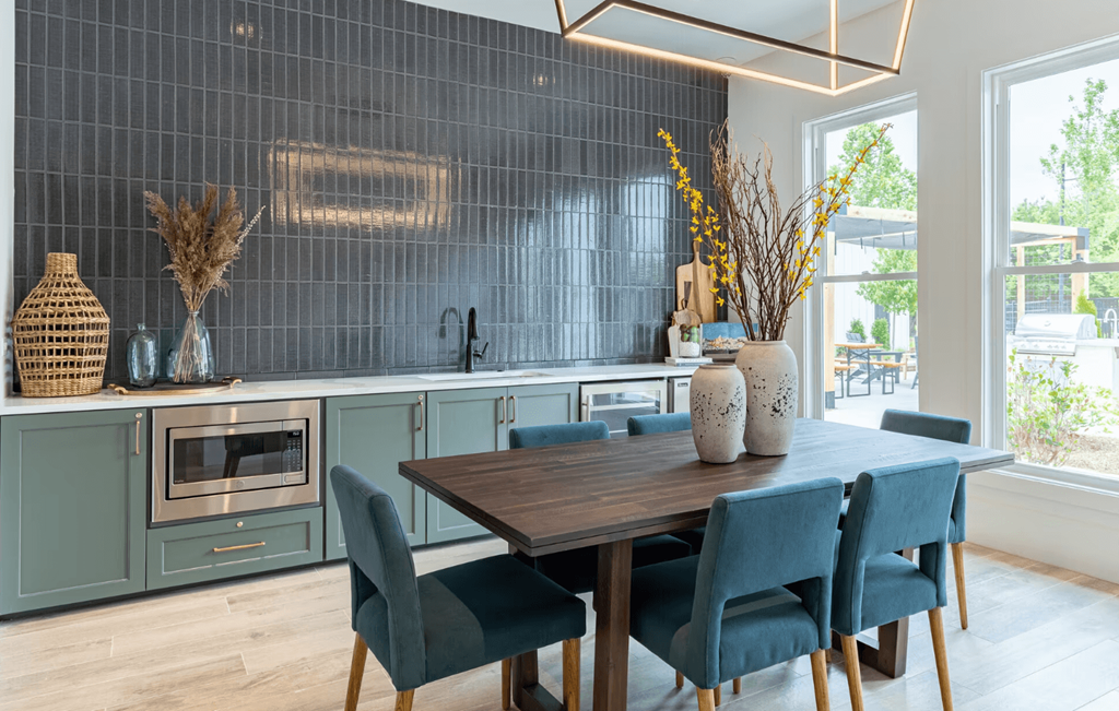 a dining room with a wooden table and blue chairs