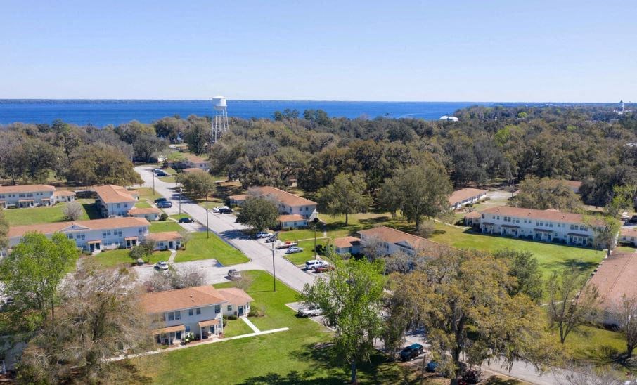 an aerial view of a neighborhood with houses and trees