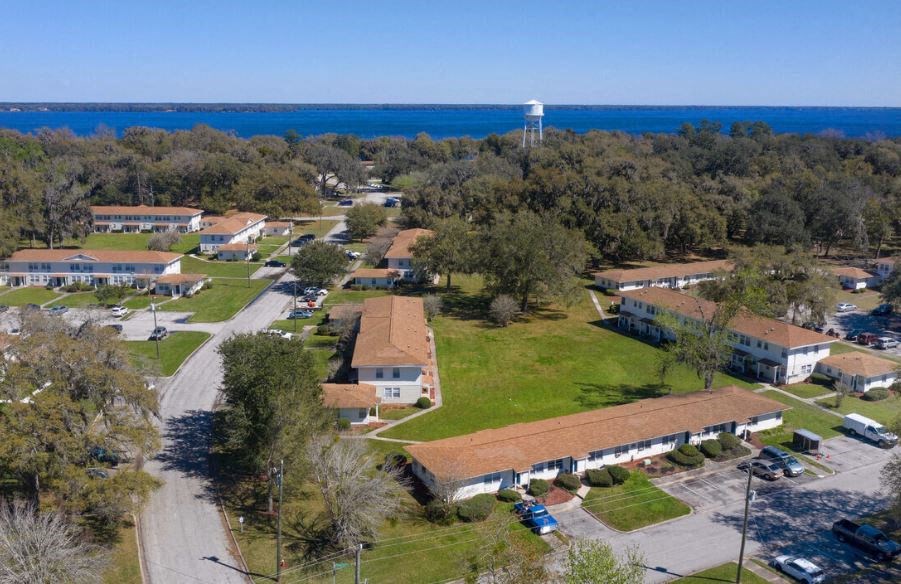 a neighborhood of houses with a water tower in the background