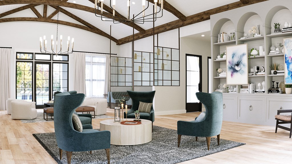 a living room with blue chairs and a coffee table