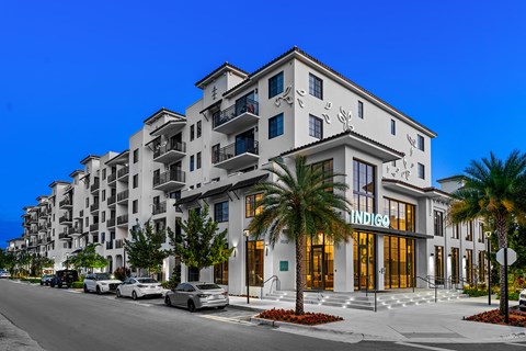a rendering of an apartment building on a city street