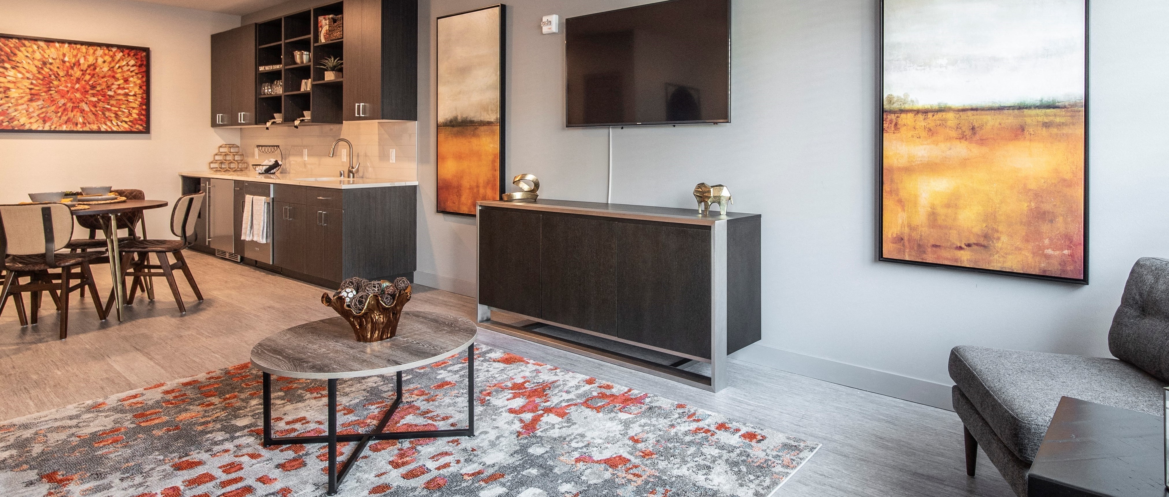 Living area with view of the furnished kitchen.