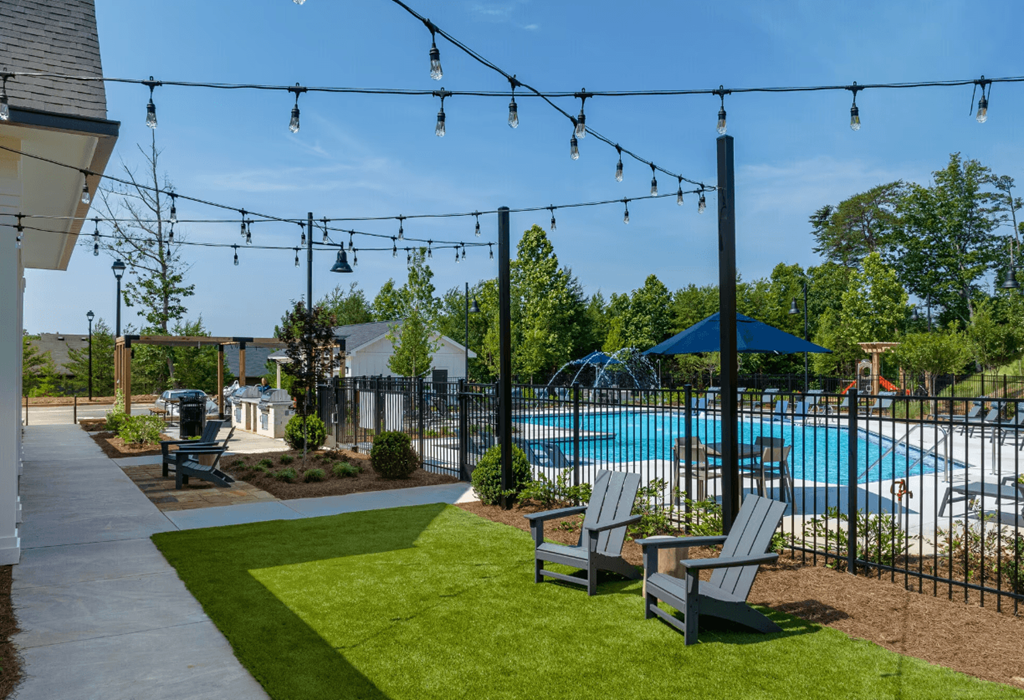 our apartments have a swimming pool and a patio with chairs