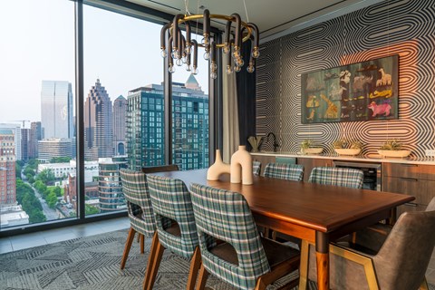 A dining room with a view of the cityscape.