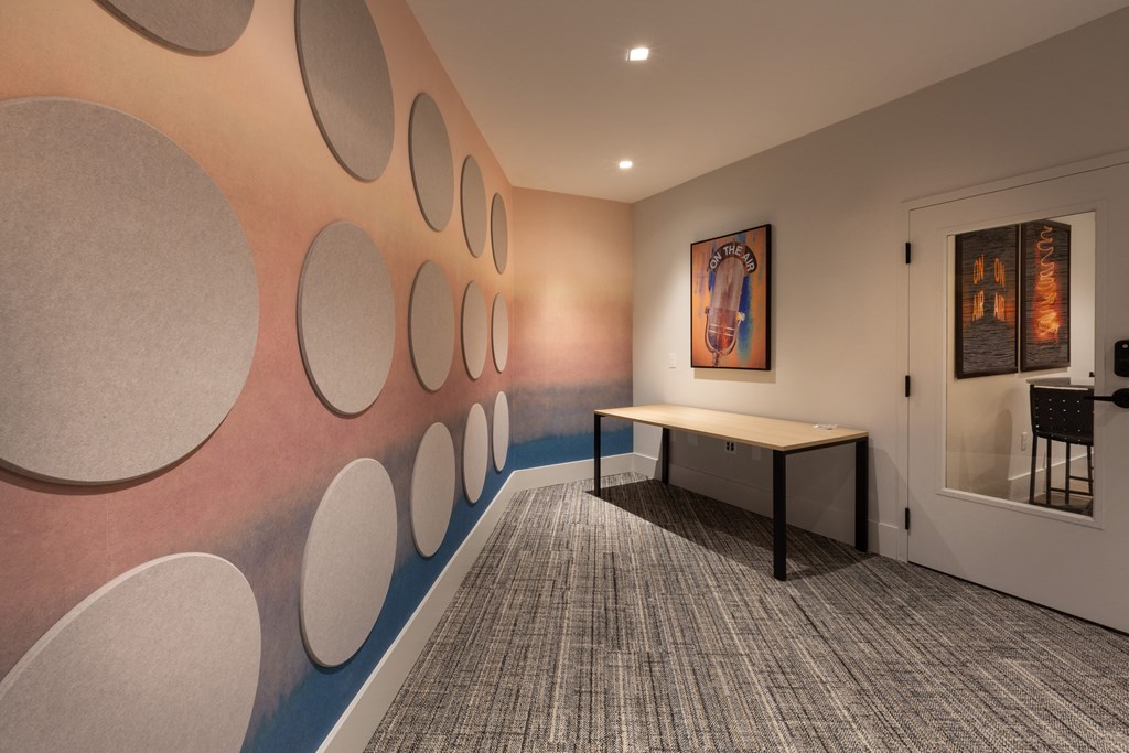 a room with a table and a wall with circles on it