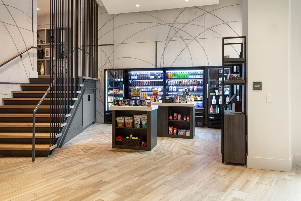 the lobby of a store with a vending machine and stairs
