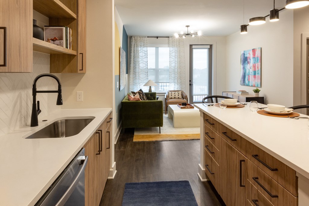 a kitchen and living room in an open floorplan apartment