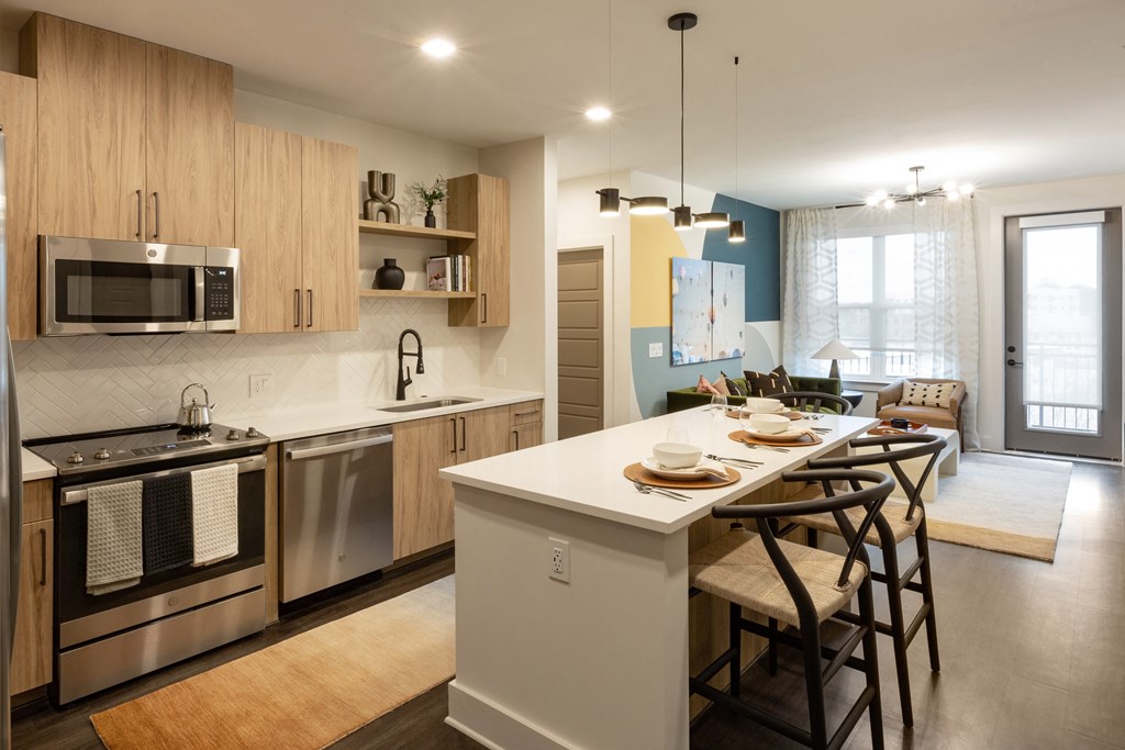 a kitchen with a large island and a dining table
