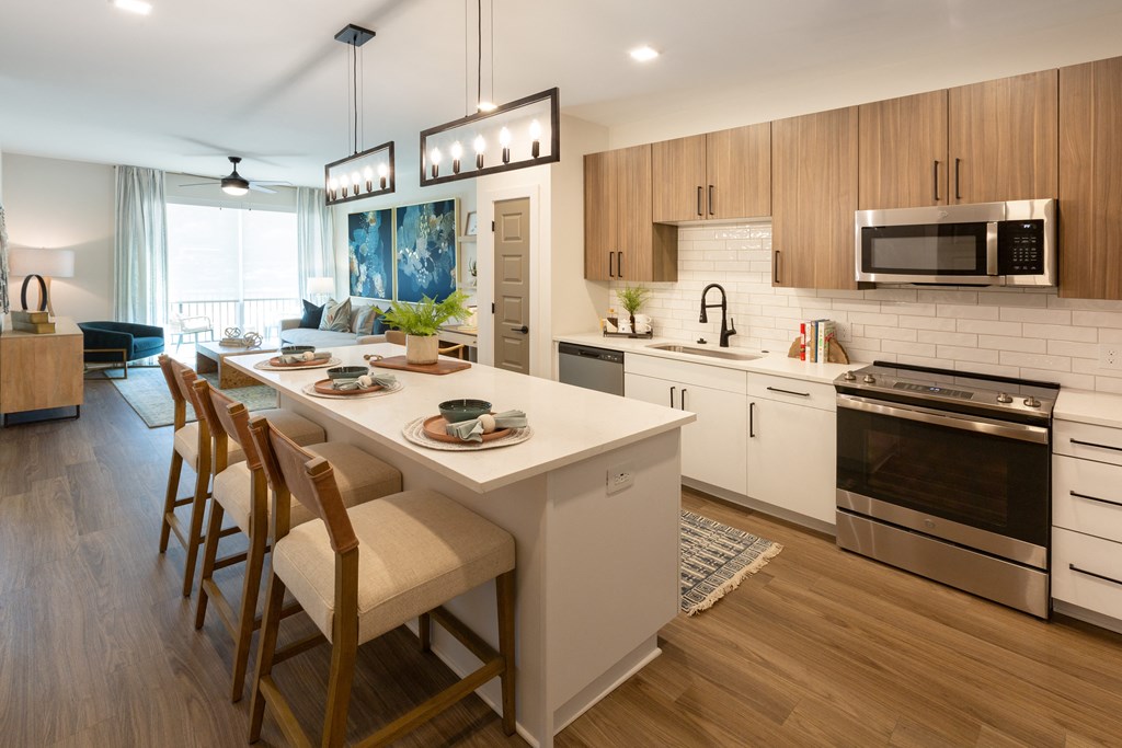 a kitchen and dining area with a table and chairs