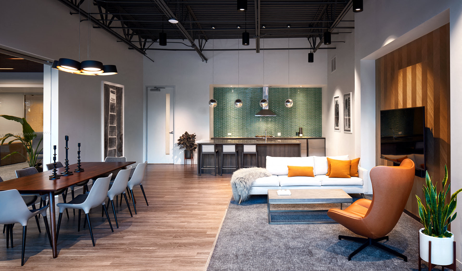 a living room and dining room with a couch and a table