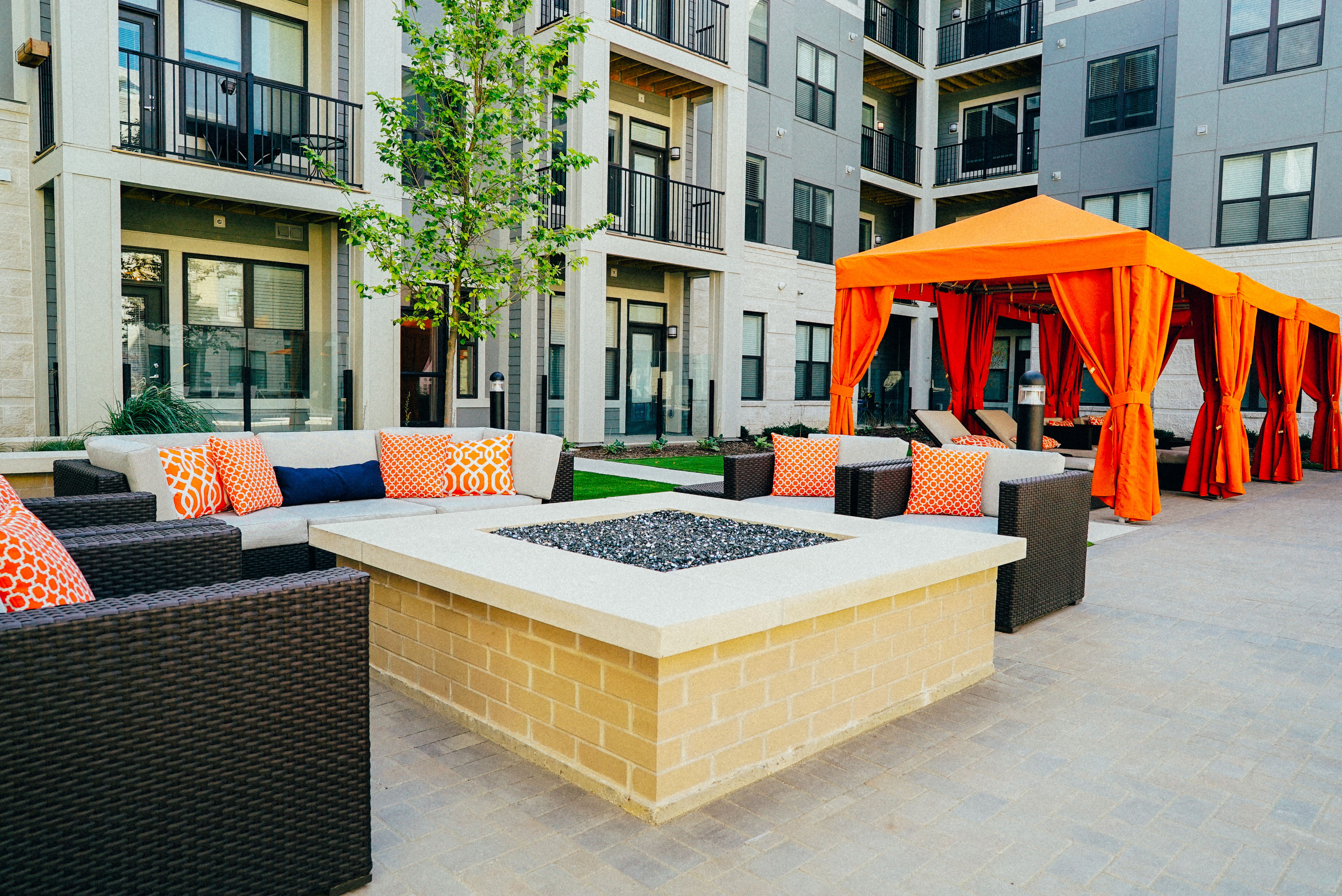 Outdoor firepit area with comfortable seating around it.
