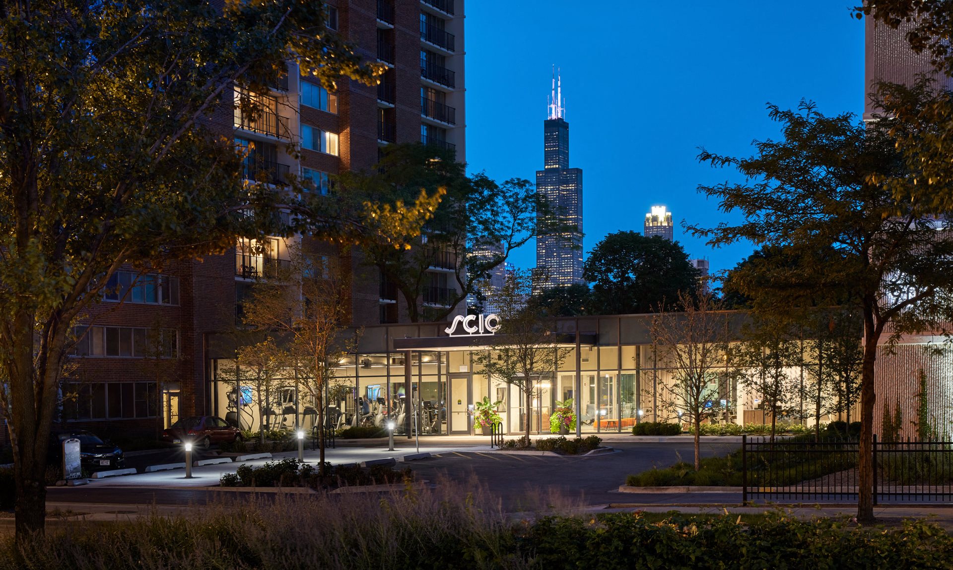 Entrance to SCIO apartments during nighttime.