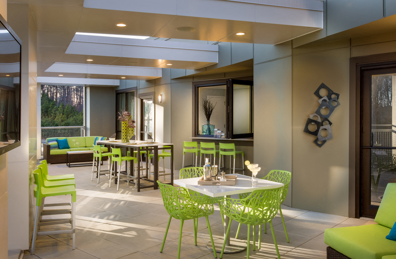 Outdoor lounge area with various tables and seating options. 