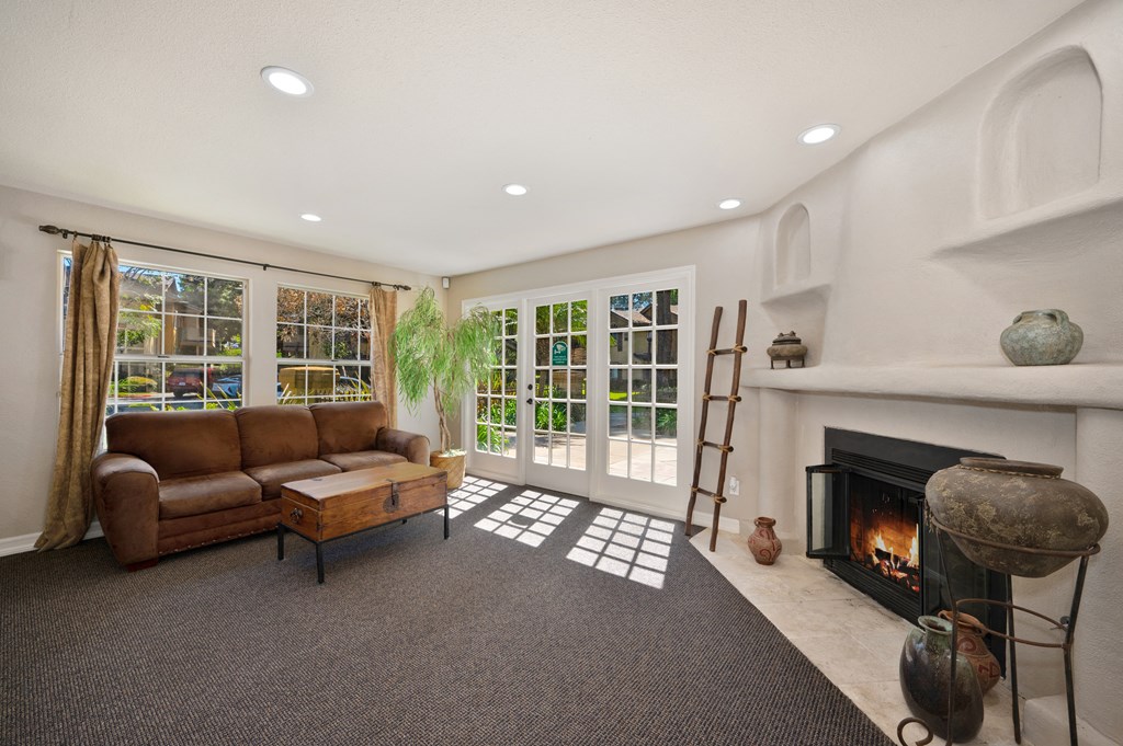 a living room with a couch and a fireplace