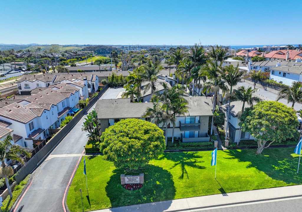 an aerial view of a neighborhood with houses and lawns