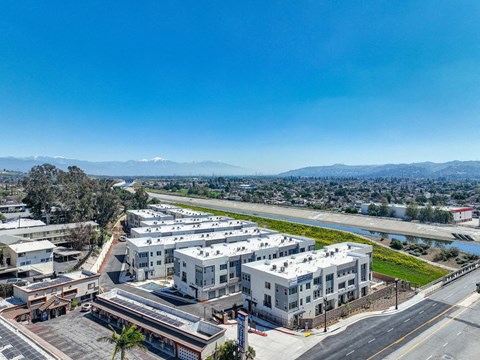 Aerial view of the community exterior with gorgeous mountains in the background.
