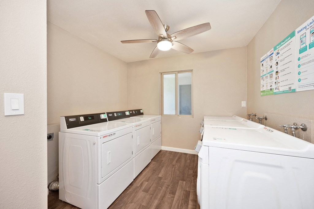 the preserve at ballantyne commons laundry room with two washers and dryers