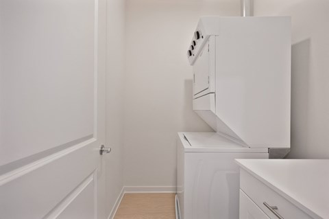 A white oven and dishwasher in a small kitchen.