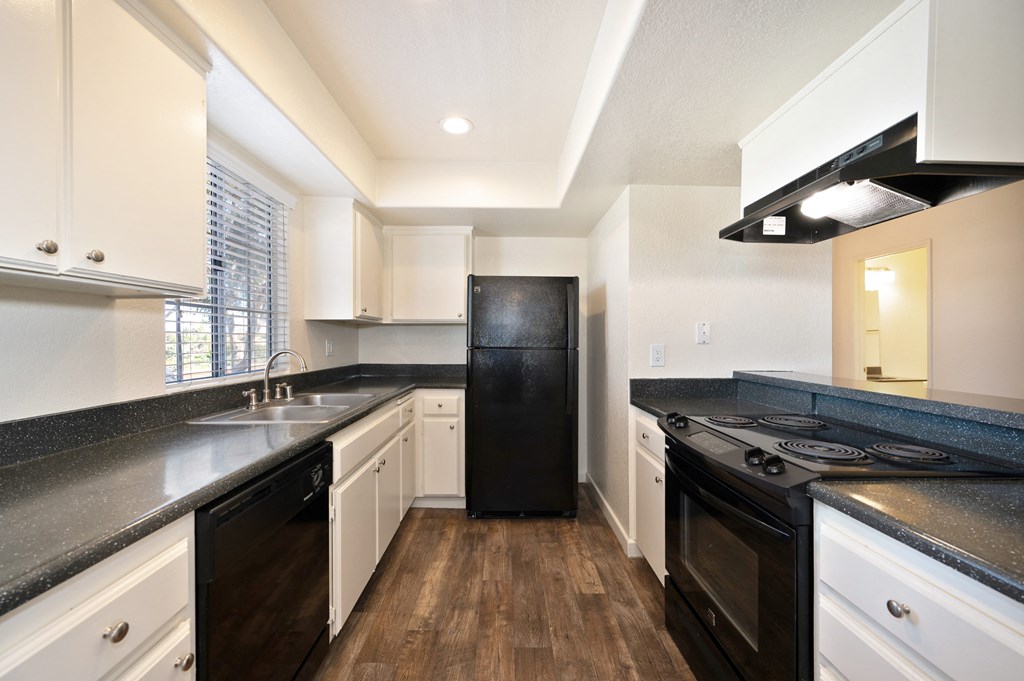 the preserve at ballantyne commons apartment kitchen with black appliances