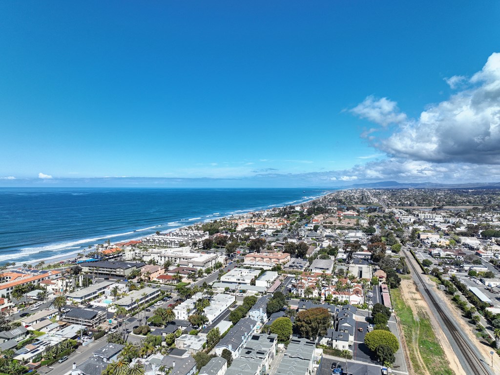 an aerial view of the city and the ocean
