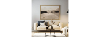 A living room with a large landscape painting on the wall, a white sofa, and a coffee table with decorative items on it.