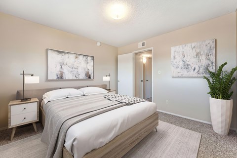 A bedroom carpet, a bed, 2 nightstands, and a painting above the bed.