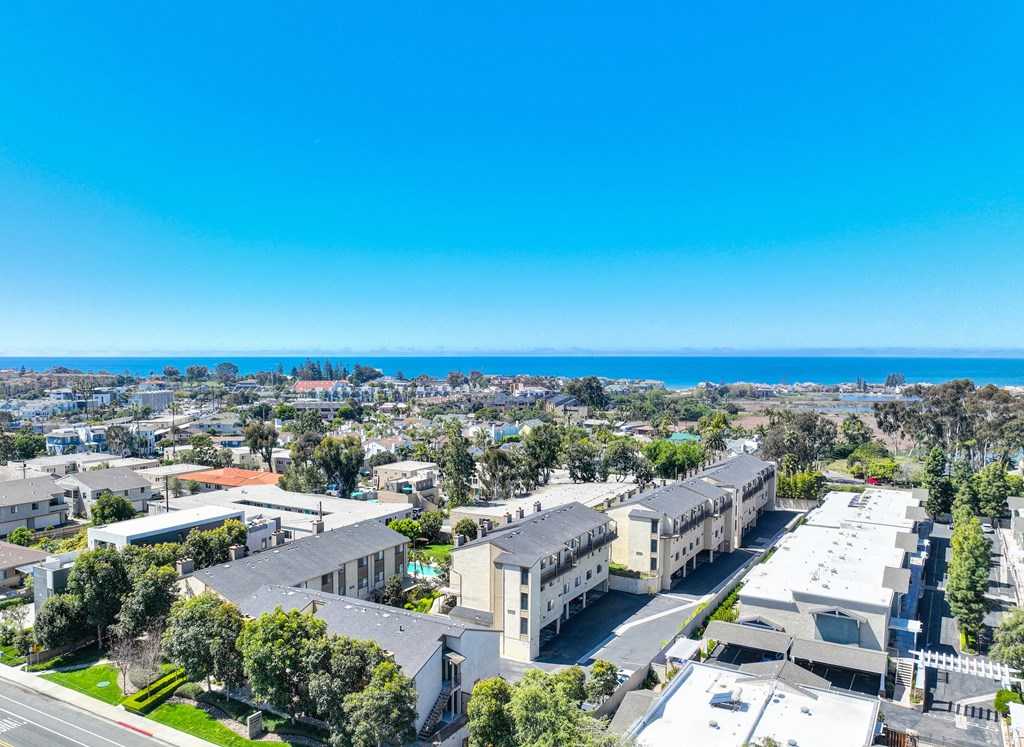 an aerial view of the city and the ocean