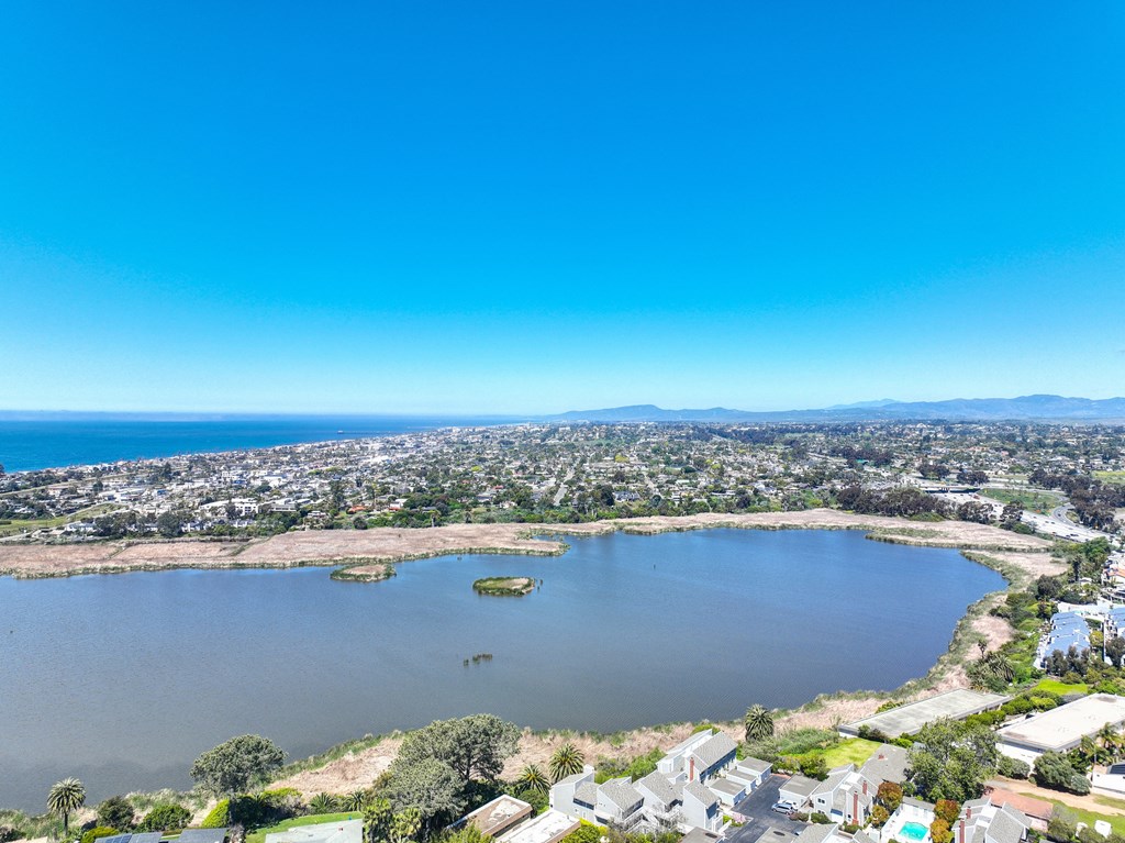 an aerial view of a lake in the middle of a city