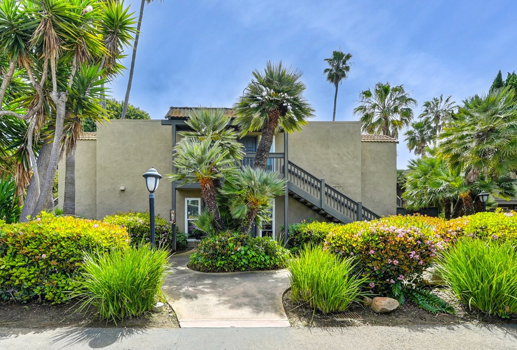 a building with palm trees in front of it