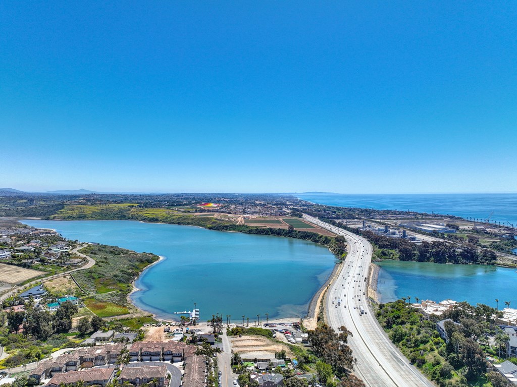 a bridge over a body of water next to a highway