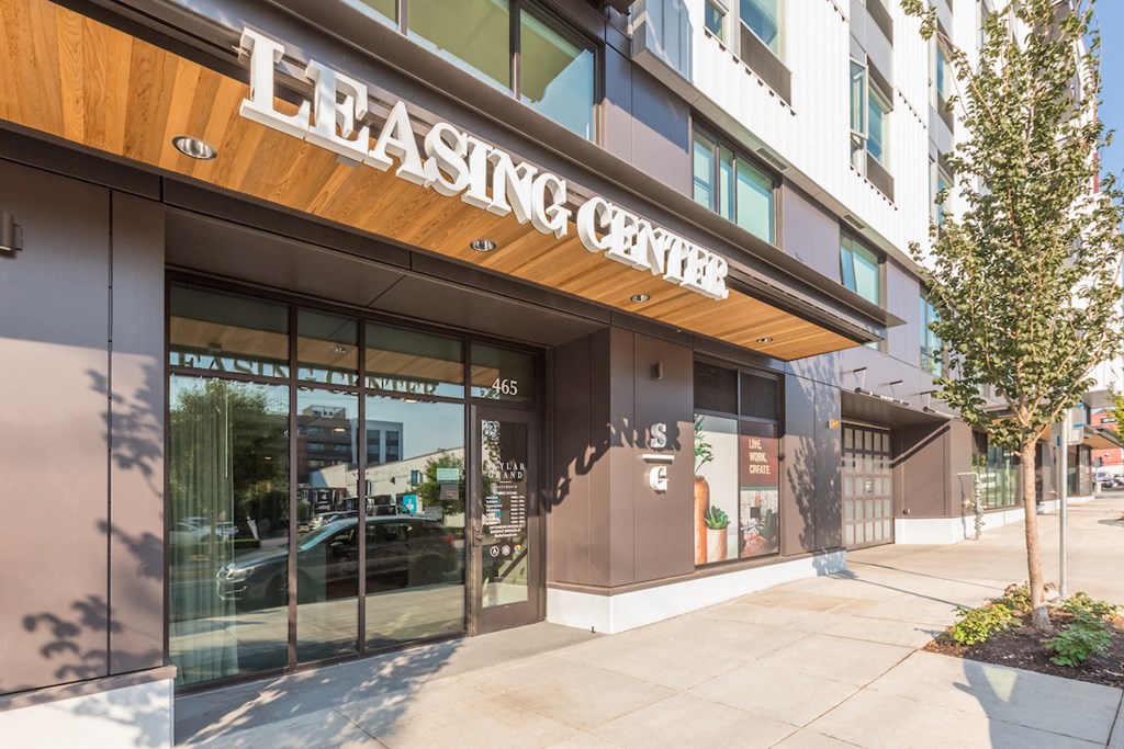 Skylar Grand leasing office entry with leasing center signage
