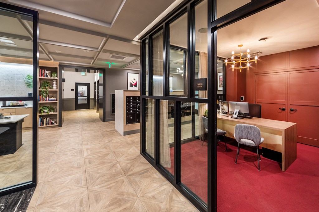 Entryway lounge and leasing office with view to coffee bar and mailroom