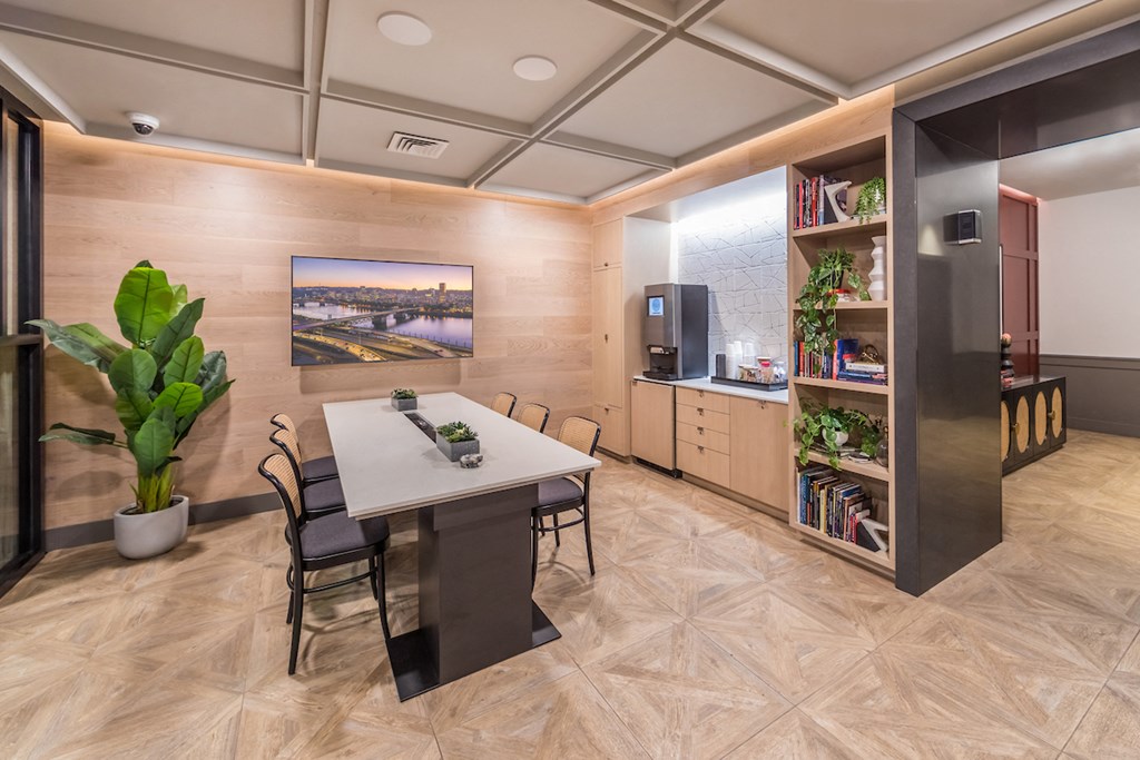 Resident lounge and coffee bar with table and television