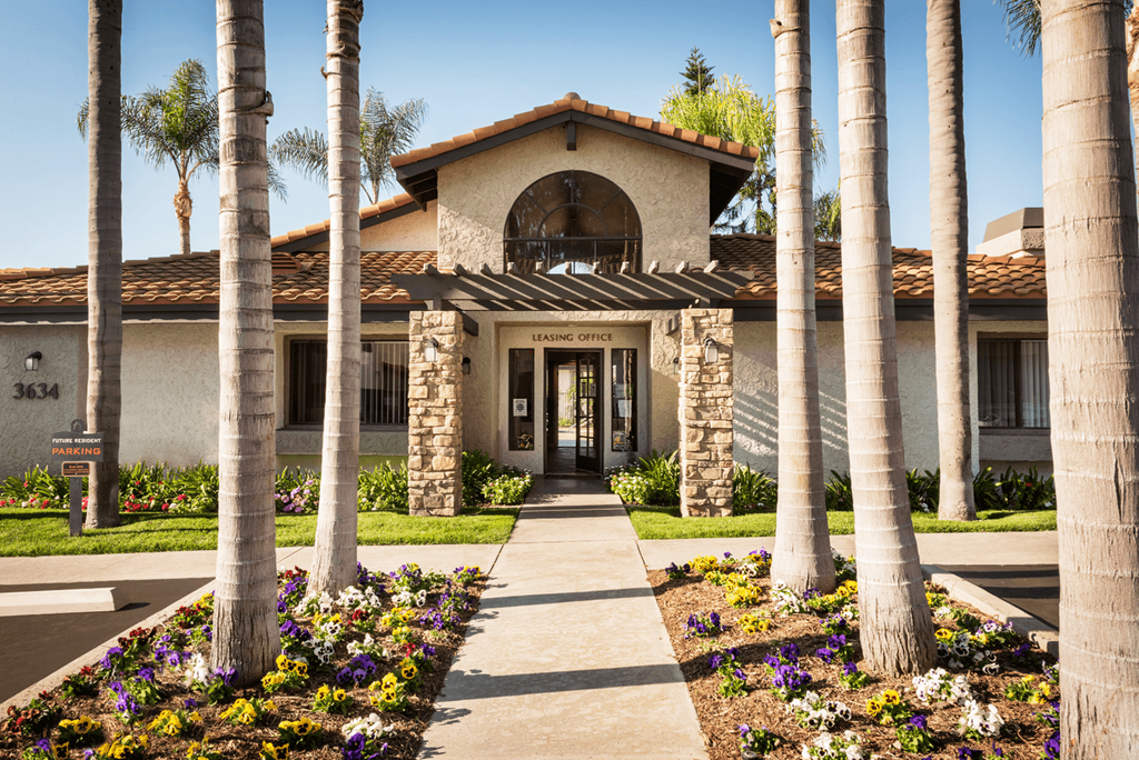 a house with palm trees in front of it