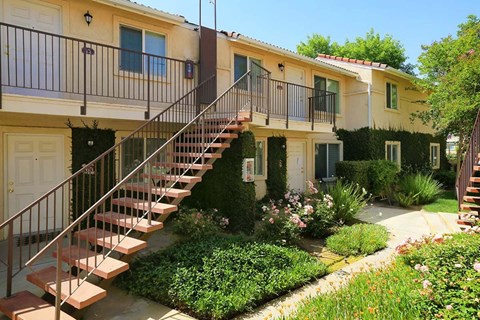 The exterior of Park Sorrento's apartments with stairs leading to the apartments