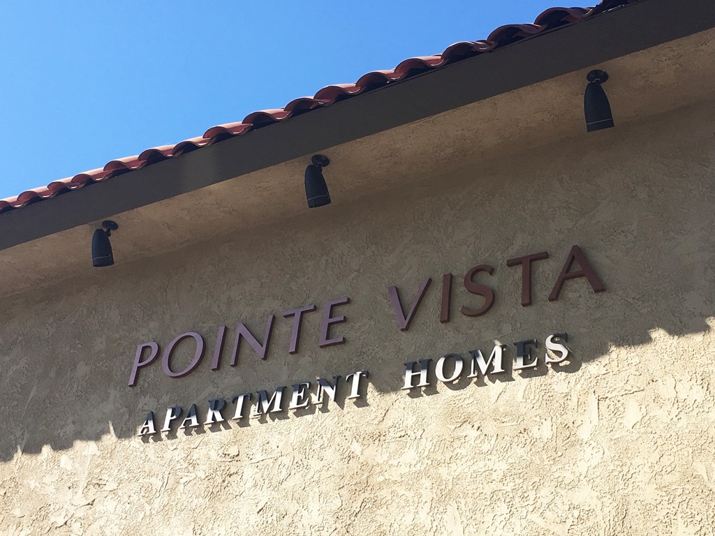 a view of the front of the point vista apartment homes building