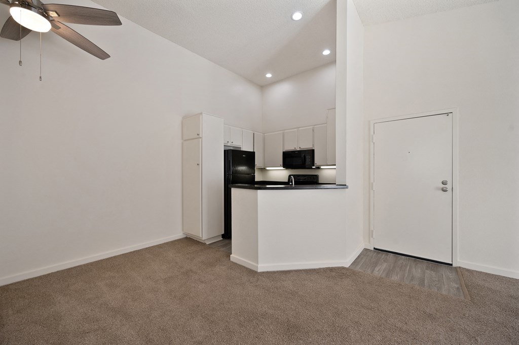 Kitchen area with vaulted ceiling