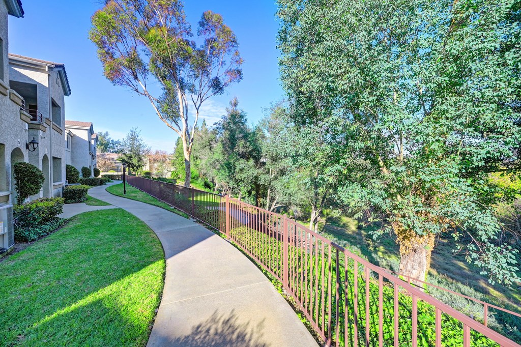 Property walkway with landscaping