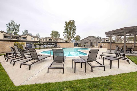 The pool area at Shadow Canyon with lounge chairs.