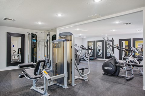 A gym with a variety of equipment