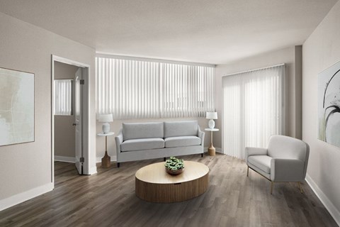 A modern living room with a white sofa, a wooden coffee table, and a white chair.