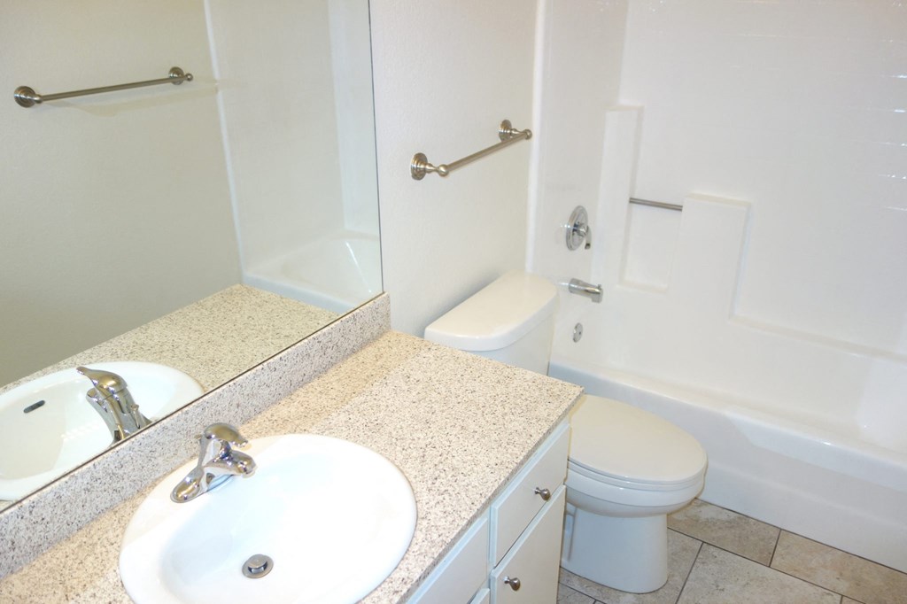 a bathroom with a sink toilet and bathtub