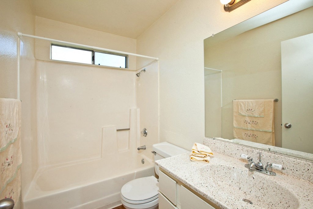 a bathroom with a bathtub and a sink