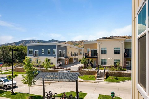 an exterior view of an apartment complex with a