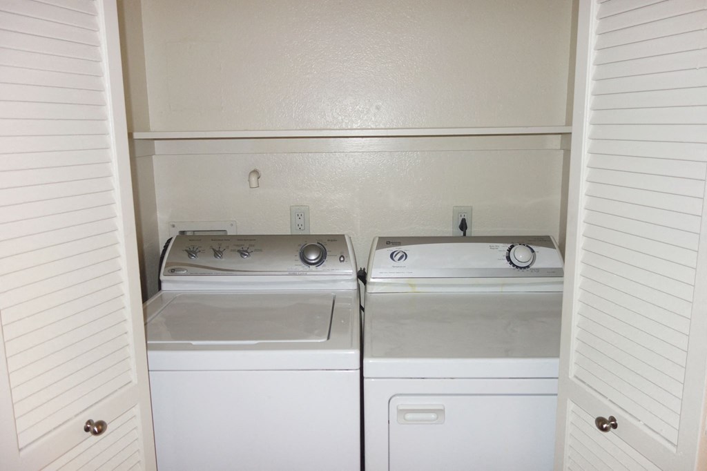 a laundry room with a washer and dryer