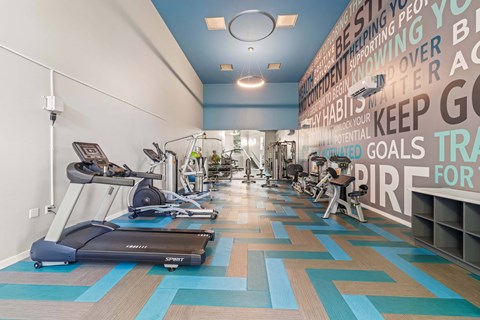 Fitness center with weight and cardio machines.